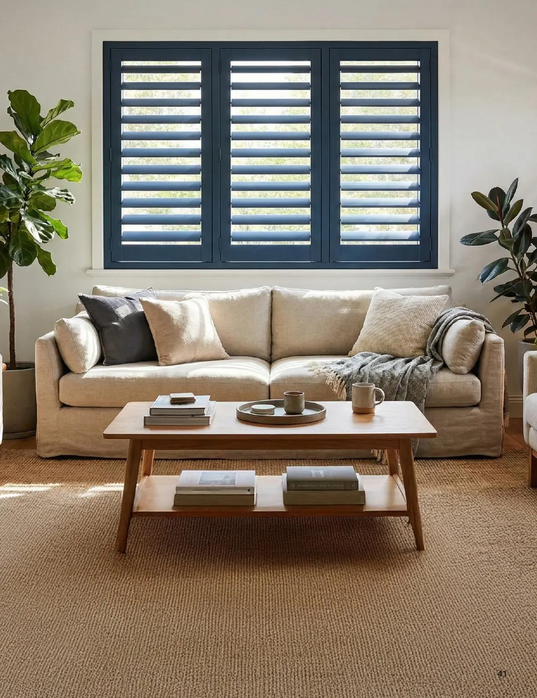 Charcoal steel window with louvres in a living room